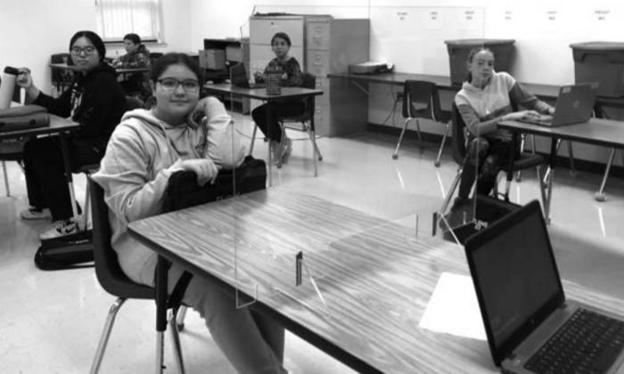 Socially distanced seating and plexiglass panels became the “new normal” for these middle schoolers this year.