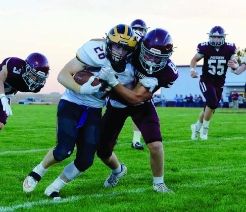 Kolby Holzer lays a hit on a Herreid-Selby running back in a game earlier this season. Keller is a formidable member of the Panther offense and is one of its leading tacklers. Photo by Marie Dupreez