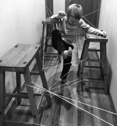 Jase doing the laser string obstacle course.