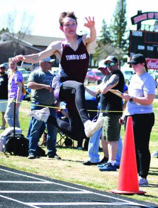 TJ Alley eyes his landing during triple jump competition at a recent outing in Mobridge. Timber Lake was slated to compete at the Ipswich Invitational on Saturday but it was cancelled due to high winds and low temperatures. Photo by Jon Flatland