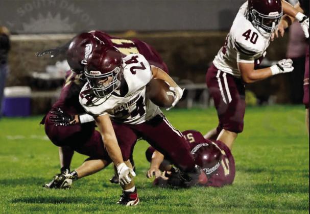 Running back Blaise Lei shakes a pair of would-be defenders to score a two-point conversion in Timber Lake’s 36-10 over Lead-Deadwood last Friday. Photo by 605 Sports