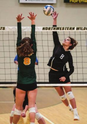 Kenna Webb (8) powers home a spike during the SoDak 16 match.