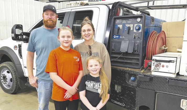 OP and Kella Schlosser with their daughters, Rae’ah and Emma.