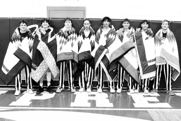 Knife-Brewer family honors basketball teams with star quilts