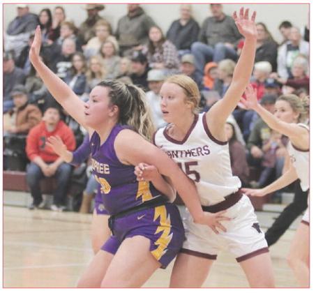 Dupree senior center Rylin Rousseau (left) battles with Timber Lake junior Kendyl Locken for post position during non-conference girls basketball action last week. Dupree went on a 16-10 run in the fourth quarter to seal a 50-42 victory. Photo by Jon Flatland