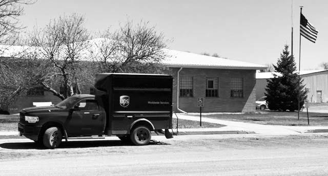 A United Parcel Service (UPS) truck sits in front of the Dewey County Courthouse in Timber Lake on Tuesday, May 2, while the driver delivers a package inside. As of Monday, May 1, UPS cut its deliveries to rural West River communities from five days to three days per week. The communities of Timber Lake, Isabel, Dupree, and Eagle Butte are among those affected by the cuts. Photo by Jon Flatland