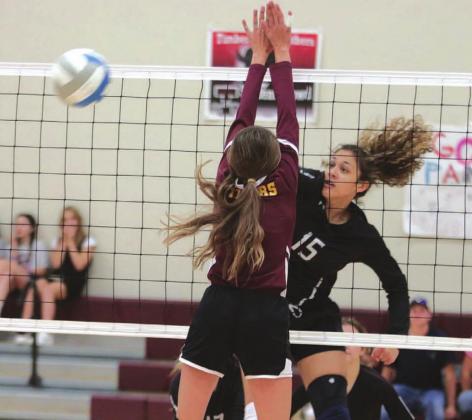 File photo by Jon Flatland Panther hitter Jasmine Nash powers a spike past a McIntosh defender in recent varsity volleyball action.