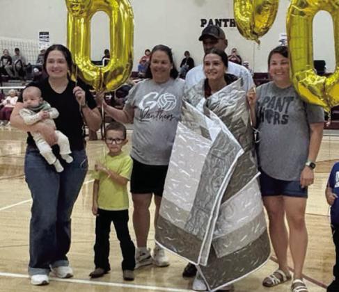 Senior Jaylee Schoelerman was recogniszed at the volleyball game on September 15 after scoring her 1000th career assist. She was presented a star quilt and other gifts She is shown with members of her family. TL School Photo
