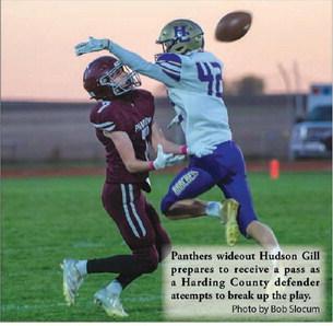 Panthers wideout Hudson Gill prepares to receive a pass as a Harding County defender ateempts to break up the play. Photo by Bob Slocum
