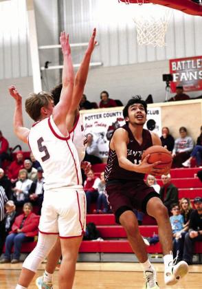 Timber Lake guard Tristan Dupris drives to the hoop for a scoop layup and two of his 18 points in the Panthers’ 62-51 loss to Potter County last Friday, Feb. 23, in the final regular season game for both teams as region tournaments tipped off Tuesday. Photo by Marie Du Preez