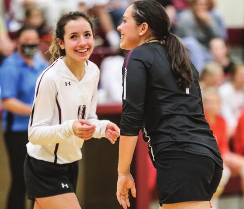 Panther volleyball players Rachel Toviah (L) and Tia LeBeau share a laugh during a recent volleyball match. Photos by Robert Slocum