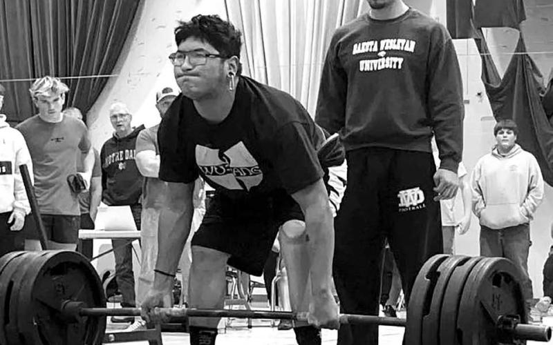 Dupree High School senior Ezekial “Bubba” Marshall attempts a lift at the Mitchell Powerlifting Invitational on Saturday, Dec. 3. Marshall and six other team members turned in lifts that qualified them for the State Powerlifting Meet in March. Photo by Zoey De La Rosa