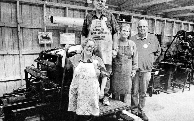 Standing with the 1895 Babcock cylinder press at the South Central Threshing Association’s historic print shop at Braddock, ND, are left to right, Prof. Lucy Ganje of the University of North Dakota, Grand Forks, Art and Lois Heinrich of Box Elder, and Roger Bailey, Executive Director of the North Dakota Newspaper Association, Bismarck, ND.