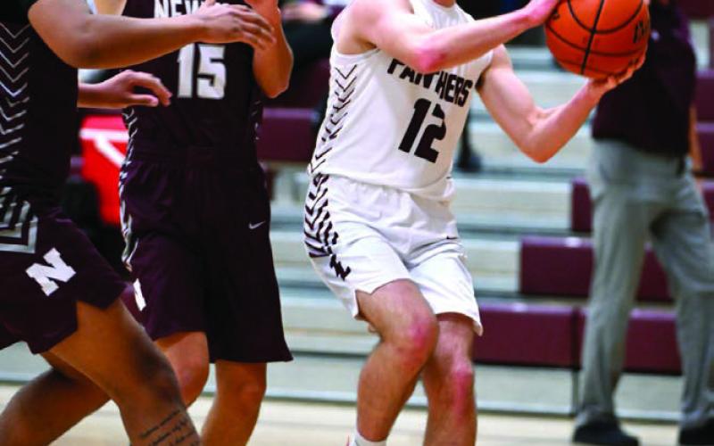 Junior guard Cole Ducheneaux drives to the hoop during the Panthers 83-19 win over Newell last week. Duchenaux finished the contest with eight points. Photo by Marie Du Preez