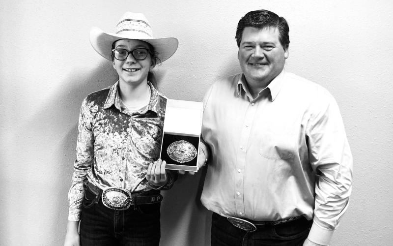 Ryan Maher of The Occidental General Store at Isabel (RIGHT) presents the SD Quarterhorse Assn. buckle for the top three-year-old out-of-state earner to Bricelyn Pederson, owner of BHR The Bomb Dot Com.