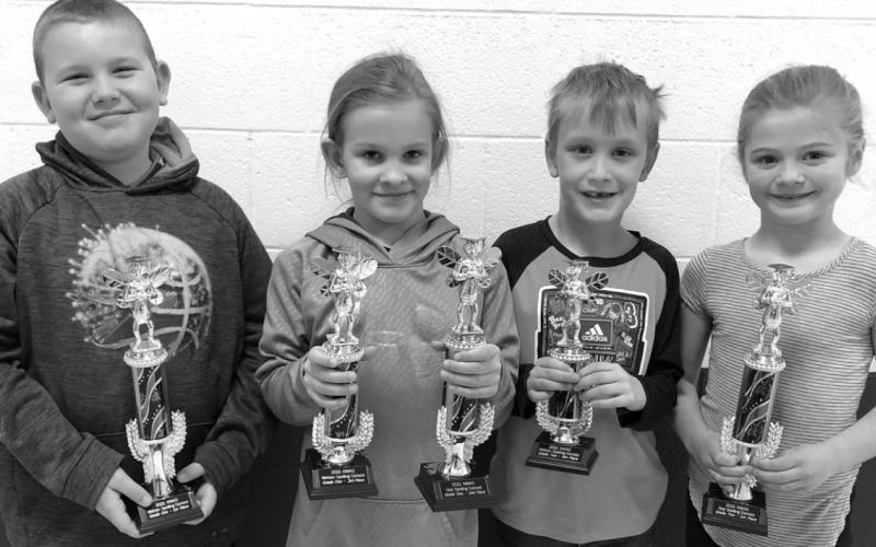Timber Lake first and second grade trophy winners are (L-R): Brayden Meier, 1st in written; Brynn Lemburg, 2nd in oral and 3rd in written; Mason Hollenbeck, 4th in written; and Alexa Roggow, 1st in oral.