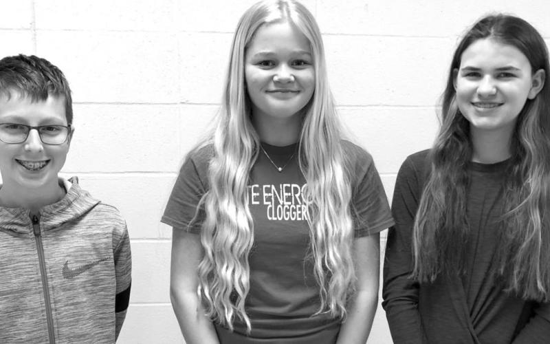 Three Timber Lake Middle School students won trophies. L-R are Hudson Gill (1st in both written and oral in sixth grade), Hailey Roggow (3rd in written and 5th in oral in seventh grade) and Meredith Maciejewski (1st in both written and oral in eighth grade).