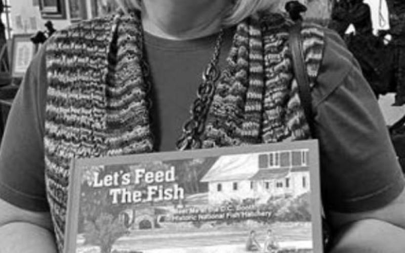 Karen Holzer of Spearfish, along with two other writers and an artist, have created a children’s book about the D.C. Booth Fish Hatchery at Spearfish.