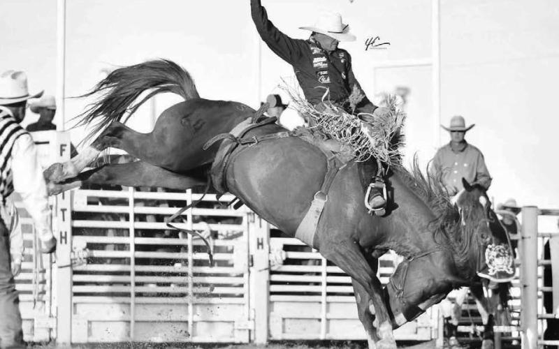 Shorty Garrett of Dupree shows his form while competing in the saddle bronc riding event at a recent rodeo. Garrett is the current leader in the PRCA’s Badlands Circuit standings and is ranked 25th overall in the world. Photo courtesy of Chuck Miner