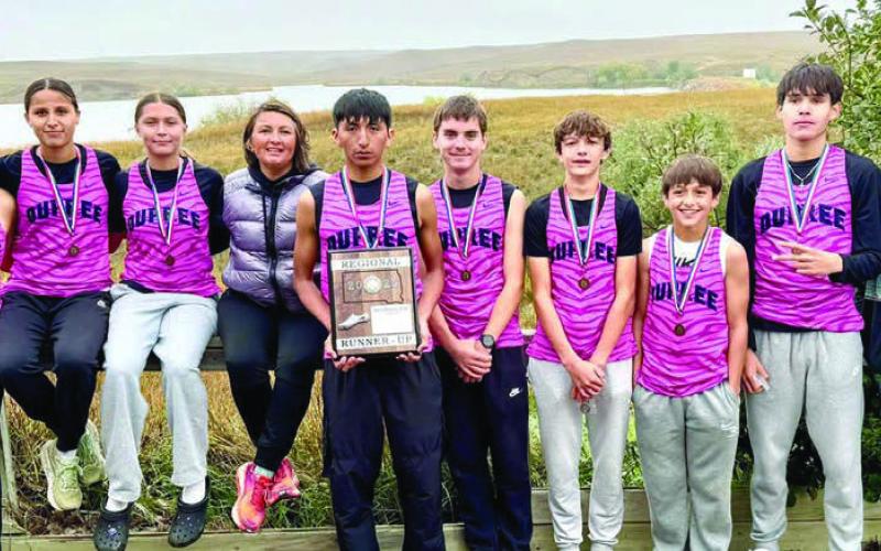 Members of the Dupree boys and girls cross country teams qualifying for the State XC Meet include (l-r)Affinity Iron Hawk, Jaeshawnia Iron Hawk, Maddlyn Red Bear, Coach Jessie Longbrake, Jayden Scott, Spencer Olsen, Walker Farlee, Rowdy Schrempp, TayShaun Cudmore, and Asst. Coach Jazmyn Holmes. Photo by Kathy Olsen.