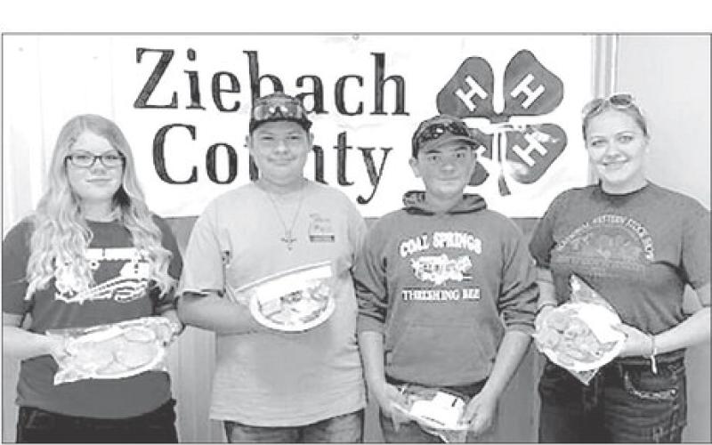 Winners of the Ziebach County Cookie Contest were (L-R) Trinity Leithauser, first place; Wyatt Lemke and Maverick Lemke, tied for second place; and Erin Lemke, third place. Gail Stambach and Bev Birkeland were the judges.