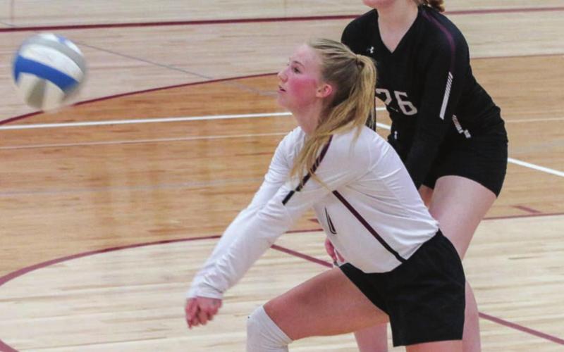 LEFT: Timber Lake’s Avery Marshall (FRONT) and Brenna Atchley (26) play defense in a recent junior varsity match.