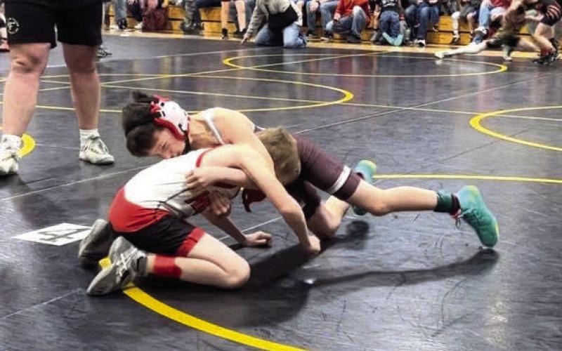 Shayde Curley (in maroon) works to get position on an opponent during recent youth wrestling action. See how wrestlers from Timber Lake, Dupree and McLaughlin fared in last Sunday’s Mobridge Youth Wrestling Invitational on Page 7B. Courtesy Photo