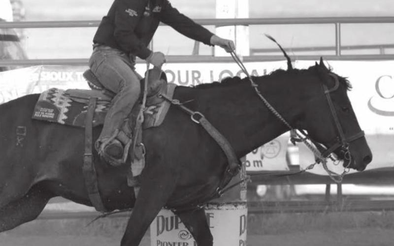 Kesse Deal competes in the barrels at the Dupree Pioneer Days rodeo. Photo by Jon Flatland