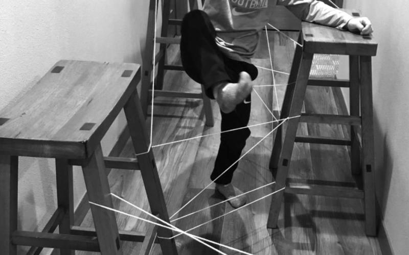 Jase doing the laser string obstacle course.