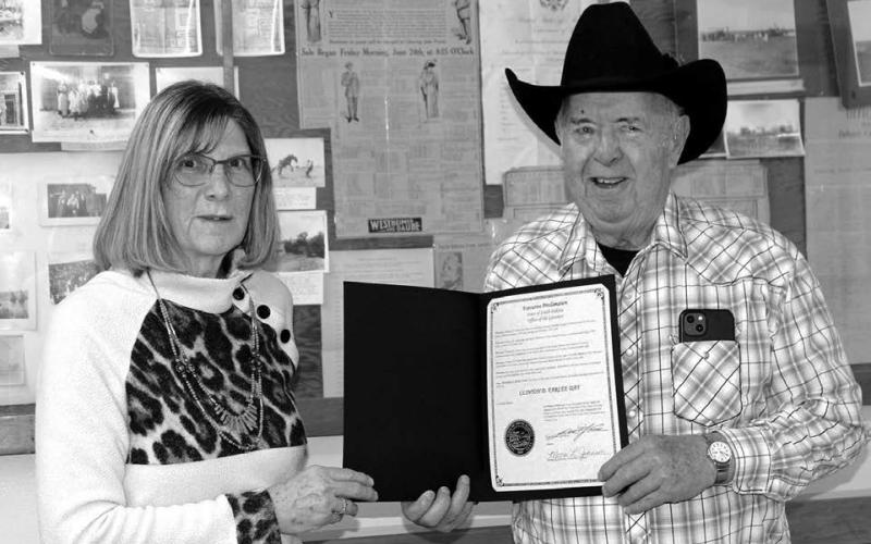 Ziebach County Auditor Cindy Longbrake (LEFT) presents Clint Farlee with a proclamation declaring December 29, 2022 as Clint D. Farlee Day in South Dakota. Photo by Patty Peacock