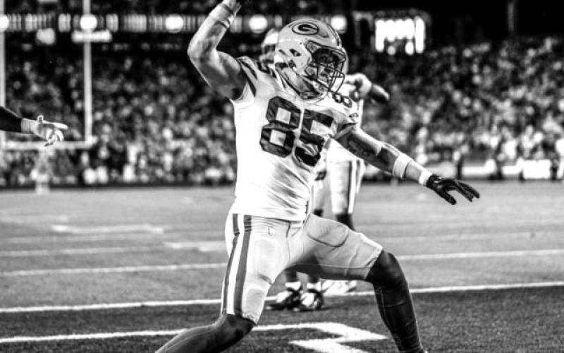 Tucker Kraft celebrates by spiking the football after pulling in a two-yard touchdown catch from quarterback Jordan Love during the third quarter of the Packers playoff matchup against San Francisco on Saturday. The game culminated a tremendous rookie season for Kraft, a native of Timber Lake. Photo courtesy of Green Bay Packers