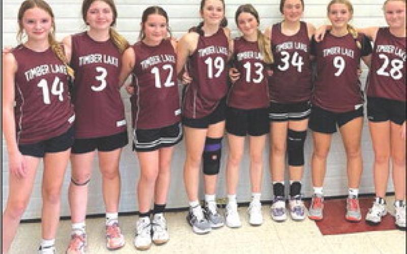 Members of the Timber Lake Grade 7-8 girls basketball team earned second place at a tournament in Faith on Saturday, Nov. 11. Team members include, L-R, Ella Handeland, Addison Lindskov, Jalee Booth, Katie Martin, Korbi Heck, Lexi Locken, Maddy Hermes and Evelyn Gill.The team is coached by Jennifer Schoelerman, not pictured. Submitted Photo