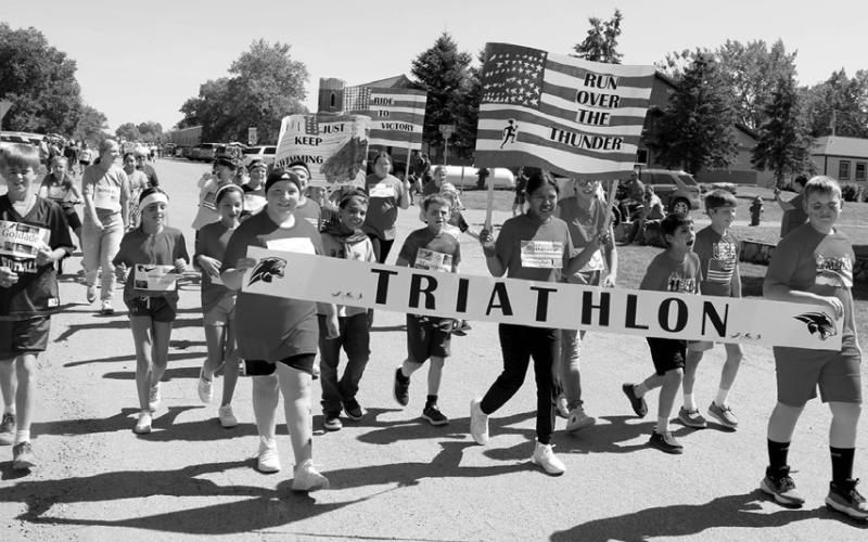 The Timber Lake Elementary School’s Fifth Grade Class were ready to “Run Over the Thunder” as the U.S. Olympic Triathalon Team during last Friday’s Homecoming Parade from the school to a pep rally at Doug Kraft Field. Photo by Jon Flatland