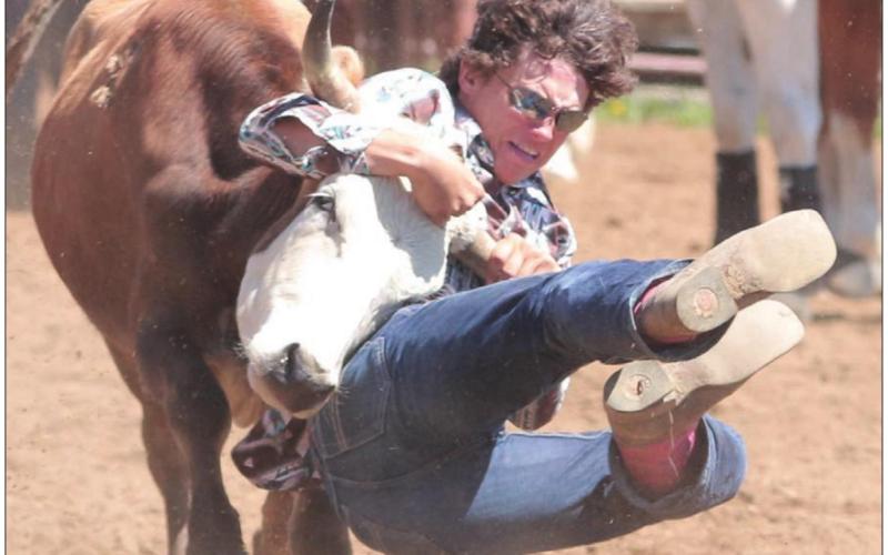 Dupree’s Bobby Brewer has his steer by the horns during the Dupree region rodeo last weekend. Photo by Jon Flatland