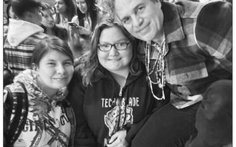 Cheyenne-Eagle Butte students Mary Francen and Roslie Lone Eagle pose with actor/activist Mark Ruffalo at the C-EB School on Monday. Ruffalo, executive producer of the documentary film “The Lakota Nation vs. U.S. of America” visited to promote the film and to listen to the concerns of elders. Photo courtesy of Rhonda Swan
