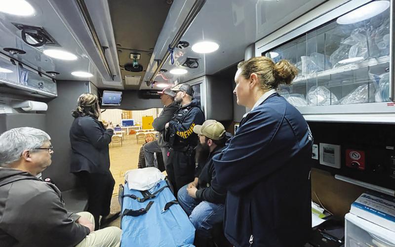 The Timber Lake ambulance crew listens to trainer Sarah Barch, left, during a March 28 training session on the new Avel equipment installed in the ambulance. The equipment remotely connects EMT’s to medical professionals at a virtual health care center in Sioux Falls.