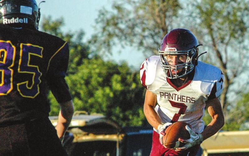 Timber Lake’s Slater Ducheneaux (7) fixes his eyes on Dupree freshman Daxton McDaniel after Ducheneaux made an interception while playing the defensive backfield during their game Friday night in Dupree. Photo by Jon Flatland