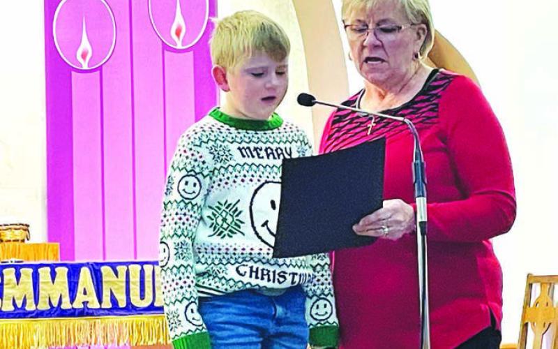 Ann Crance and grandson Isaac Schweitzer sang “The Little Drummer Boy” accompanied by Sarah Schweitzer on piano, Evan Schweitzer on drums, and Owen Schweitzer on guitar.