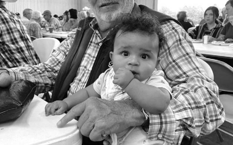 Dan Booth and his grandson, Atlas Chance Daniel Cunningham, enjoyed each other’s company while the baby’s mom, JoLeah, talks with some friends she hasn’t seen in a while.