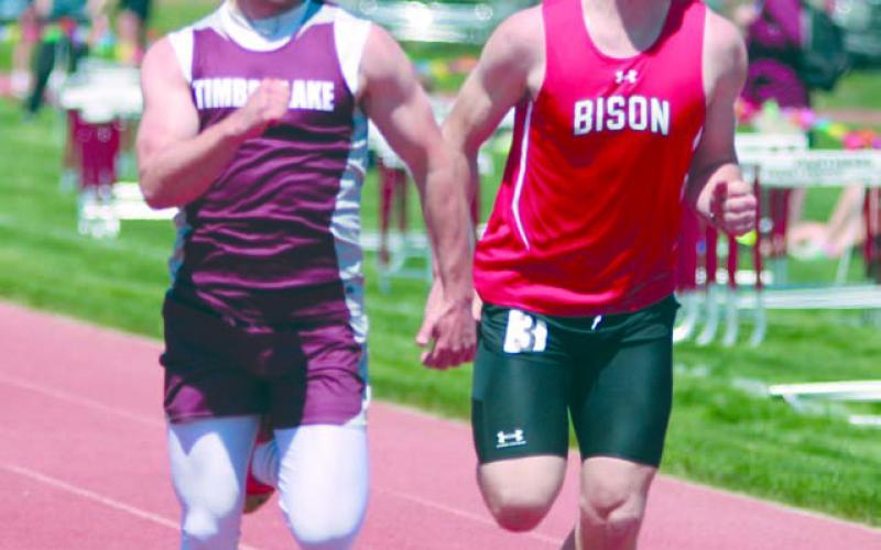 Timber Lake senior Jayden Miller edged Bison’s Rylee Veal at the finish line of the 100 meter run during the Region 8B track meet last Friday, May 19. Miller won the region title and qualified for the State track meet this weekend in Sioux Falls. Photo by Jon Flatland