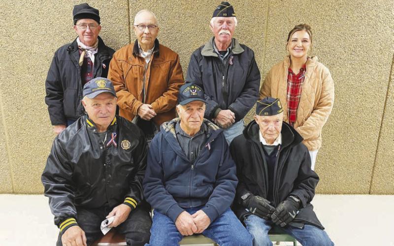 Six local veterans and one active duty member were recognized at the Veterans Day program held at the Timber Lake School on November 8. FRONT (L-R): John D. Boldt, Val Schweitzer, Andy Aberle; BACK: Keith Dorsey, Larry Gill, Jack Bickel and Veronica Handeland (active duty with the U.S. Public Health Service Commissioned Corps.)