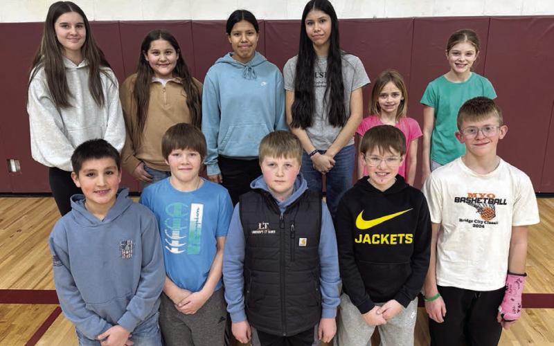 Local Knights of Columbus Hoop Shoot competitors include (front L-R) Jett Fiddler, Monroe Kraft, Austin Lindskov, Karter Lindskov, Luke Beer; (back, L-R) Kylie Lawrence, Aliviah Schambriel, Oaklee Mutchler, Autym Red Bear, Harper Biegler, Raelyn Quaschnick. Not pictured is Vern Long. Topic Photo/ Kathy Nelson