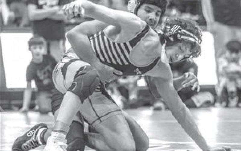 Junior Carmine Crow Ghost tries to work free from an opponent during the 2023 LNI Wrestling Tournament in Rapid City last week. Crow Ghost finished runner-up at 138 pounds. Photo by Robert Slocum