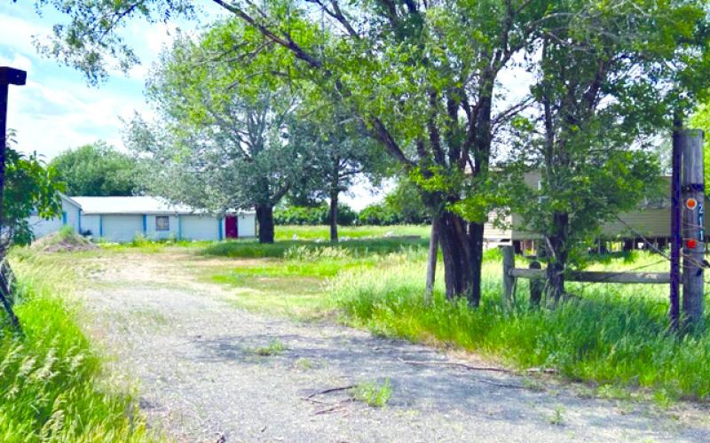 Brothers Judah and Damon Leier moved a gutted trailer home to this property owned by Don Hinton Jr. on the south edge of Isabel for their Happybel Farms medical marijuana-growing facility. Topic File Photo