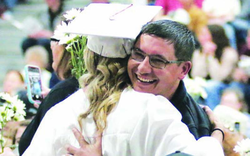 Cody Lawrence hugs his daughter Carlie.