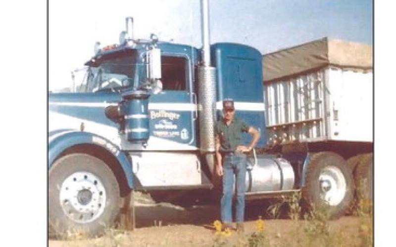 Gene Bollinger poses with one of his trucks during the 1970s. Bollinger Trucking is celebrating 70 years of service this weekend.