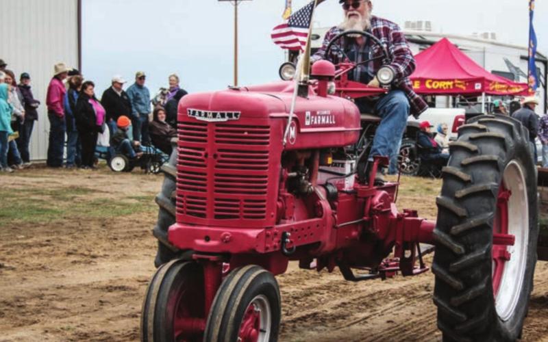Lots of antique tractors, including this Farmall M driven by Jack Deland and owned by Jens Hansen, were on display during Saturday’s parade.