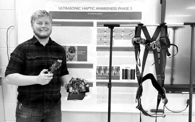 Shawn Quinn shows his winning project, “Ultrasonic Haptic Awareness: Phase 2,” which won him a trip to the Regeneron International Science and Engineering Fair in Los Angeles next month.