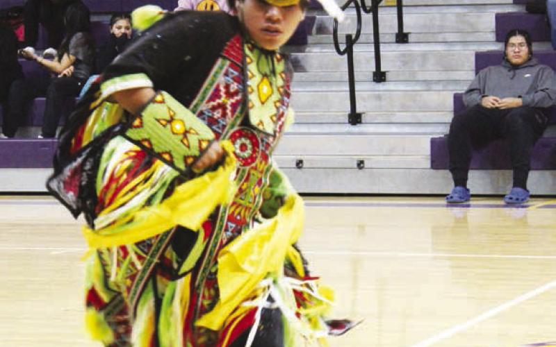 AT RIGHT: Norman Roach performing for the Dupree students and staff during Native Pride Week. FAR RIGHT Norman Roach's grandson, Blue Star, dancing at Dupree School.
