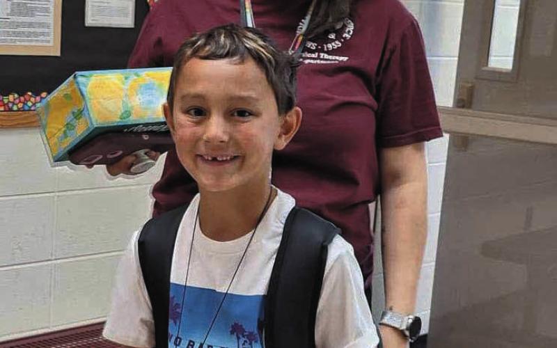 Daxtin Lawrence, with his mom Kacie, was very excited for his first day back at Dupree Elementary. Photos by Patty Peacock